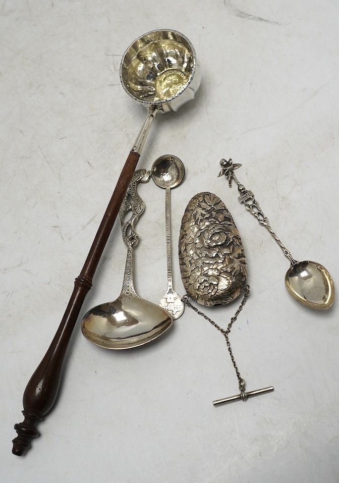 A collection of assorted mainly 19th century and later small silver and white metal items, including flatware, a photograph frame, a Japanese? scent bottle, a tea strainer, a toddy ladle, etc. Condition - poor to fair to